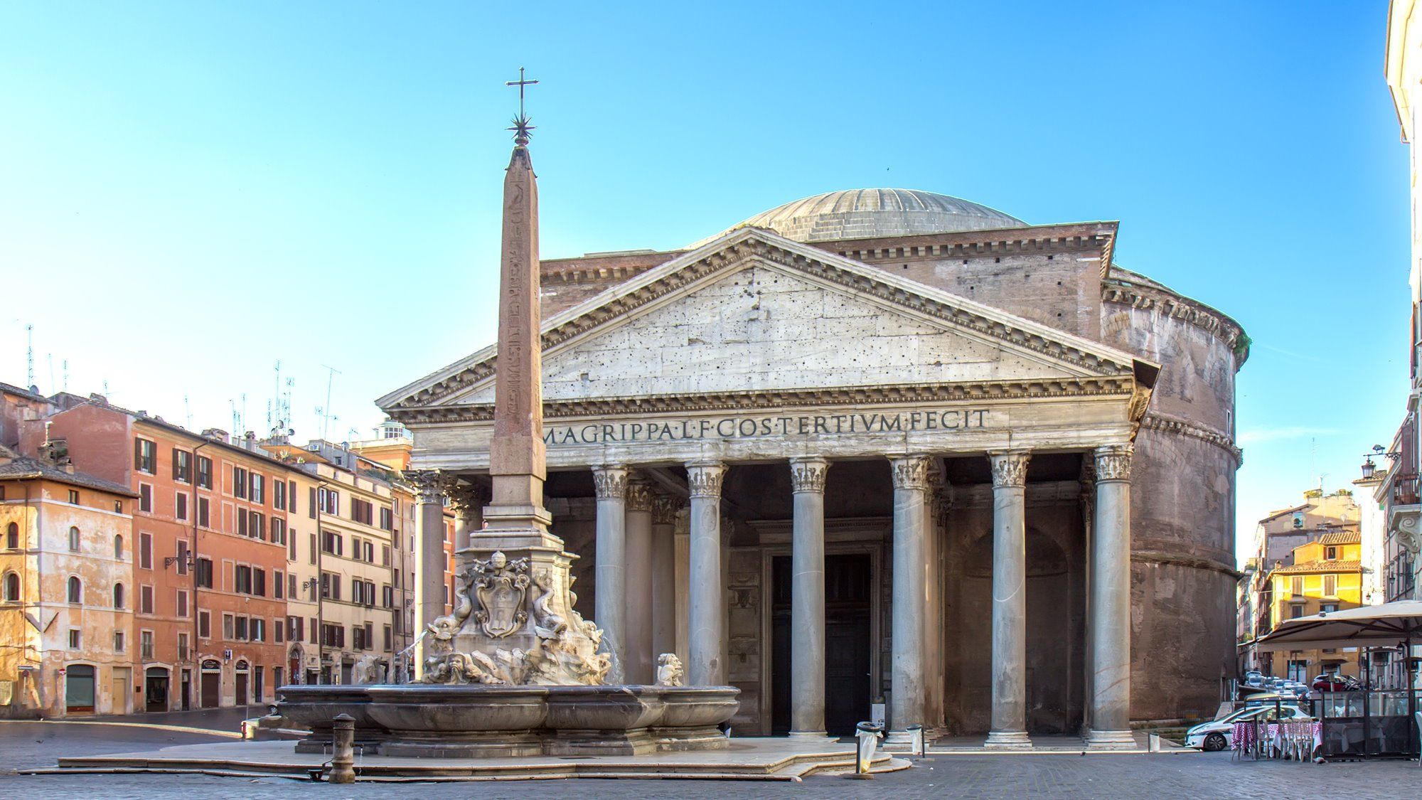 The front view of the ancient Pantheon in Rome, with the Baroque fountain and the ancient Egyptian obelisk in front of it.