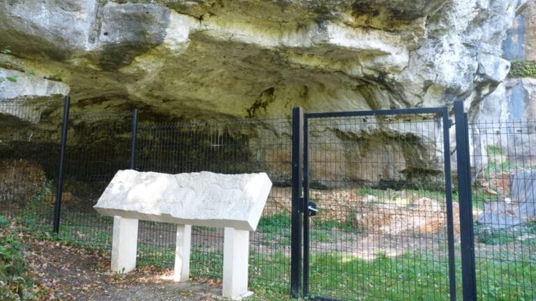 A rock shelter that has been fenced off to protect the remains of the Ice Age art.