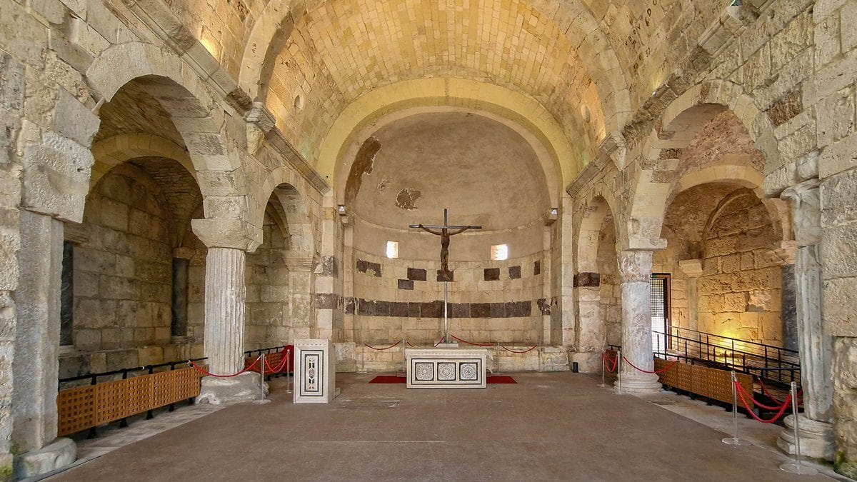 Looking down the reconstructed nave of the 5th century AD basilica towards the apse.