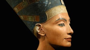 Close up of the limestone bust of Nefertiti showing her face.