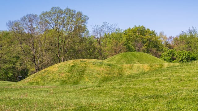 Freshly mowed grass-covered Native American mounds in Ohio.