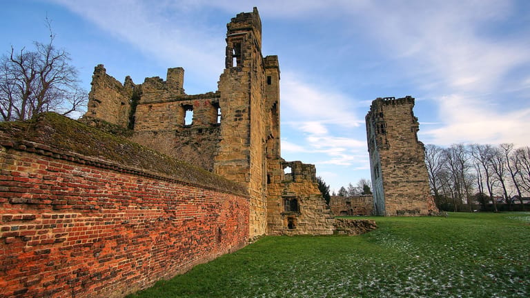 Striking red brick ruins of Ashby de la Zouch Castle.
